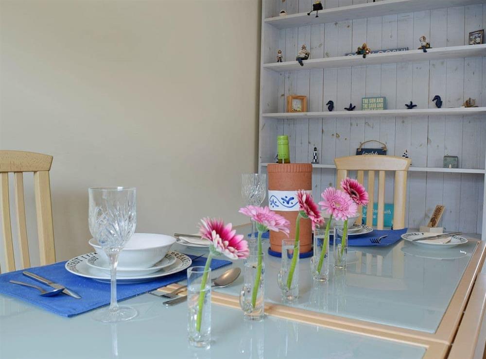 Welcoming dining area at Bracelet Cottage in Mumbles, near Swansea, Glamorgan, West Glamorgan
