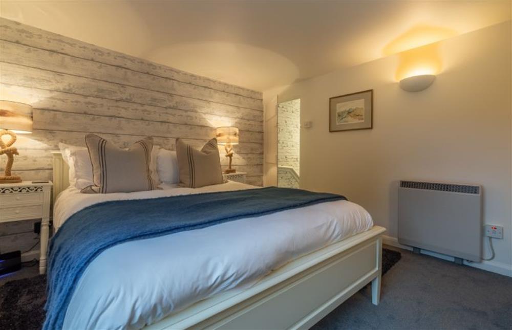 First floor:  The King-size bed is dressed in luxury linens at Bracken Cottage, Brancaster Staithe near Kings Lynn