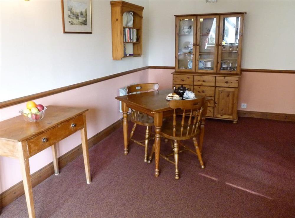 Appealing dining area at Bracken Cottage in Wheddon Cross, Exmoor, Somerset