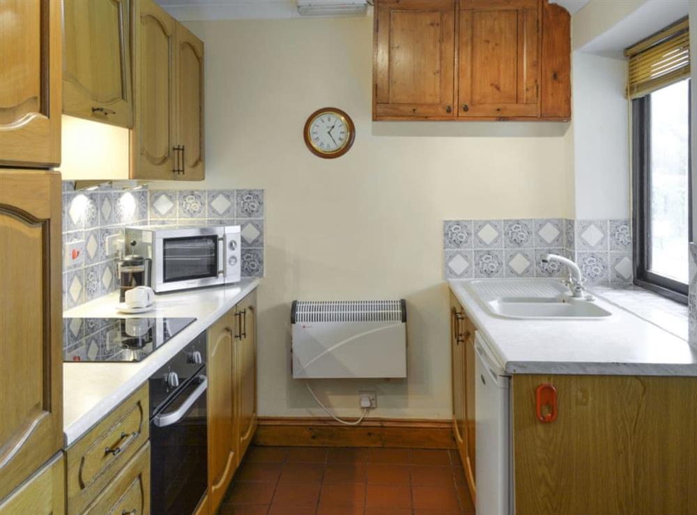 Well-equipped fitted kitchen at Bracken Cottage in Wheddon Cross, Exmoor, Somerset