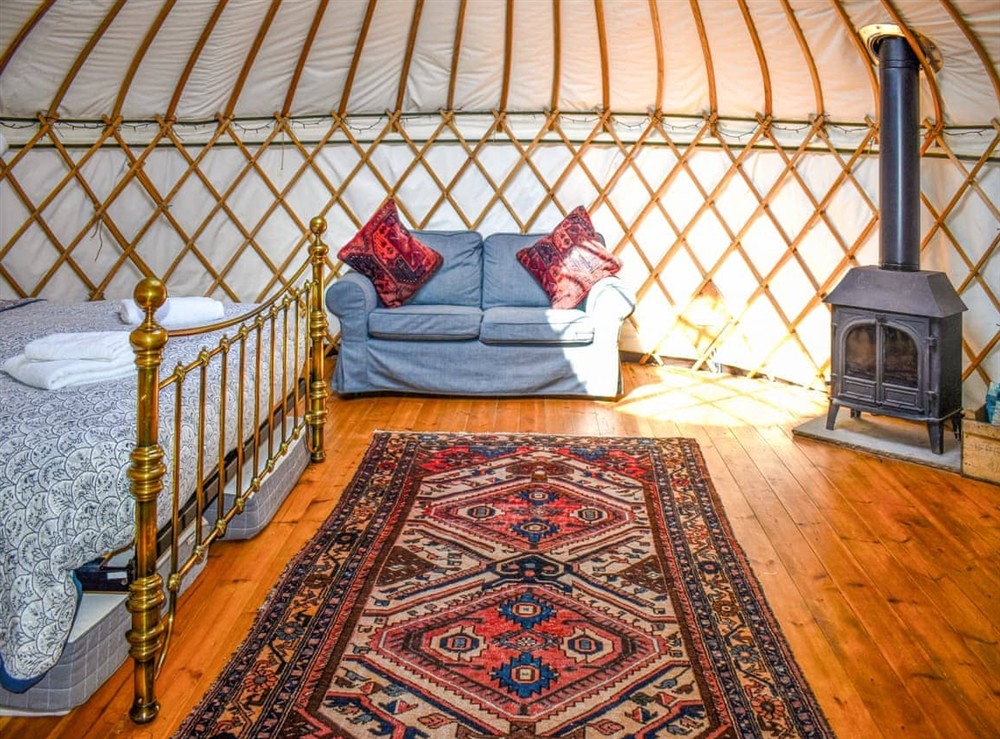 Open plan living space at Bracken Yurt in Beaminster, Dorset
