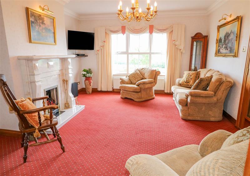 Relax in the living area at Braeside Farm House, Cloughmills