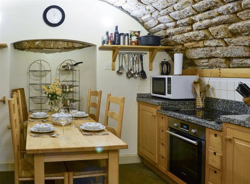Kitchen/diner with barrel-vaulted stone ceiling at Braidwood Castle, 