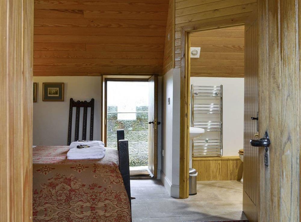 Top floor double bedroom with en-suite shower room at Braidwood Castle, 