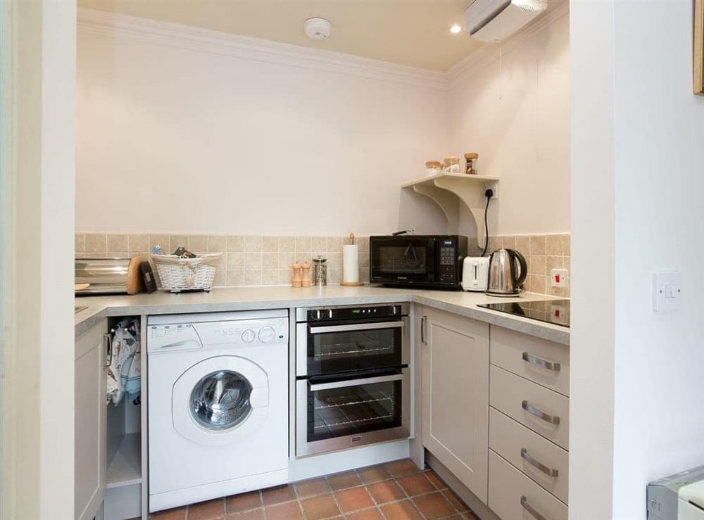 Compact fitted kitchen at Orchard Cottage, 