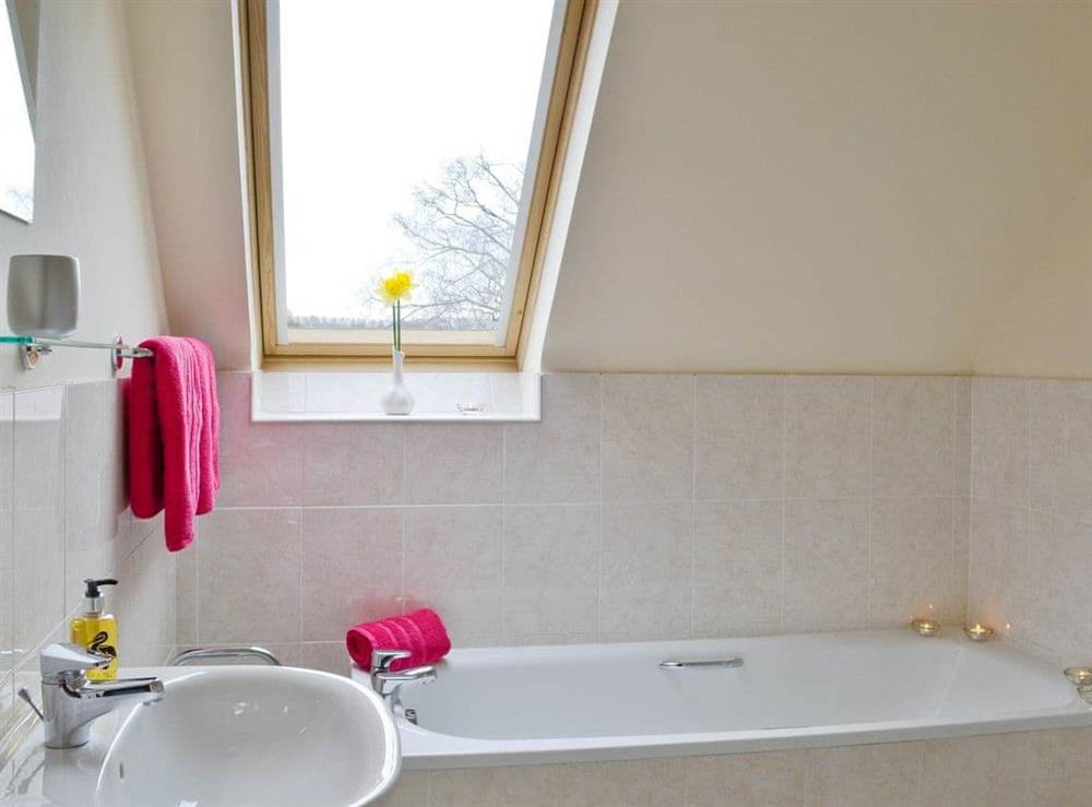 Family bathroom with bath and separate shower cubicle at Bramble Cottage, 