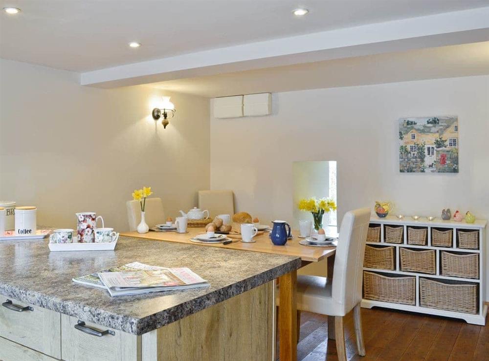 Light and airy breakfast bar and dining area in kitchen at Bramble Cottage, 