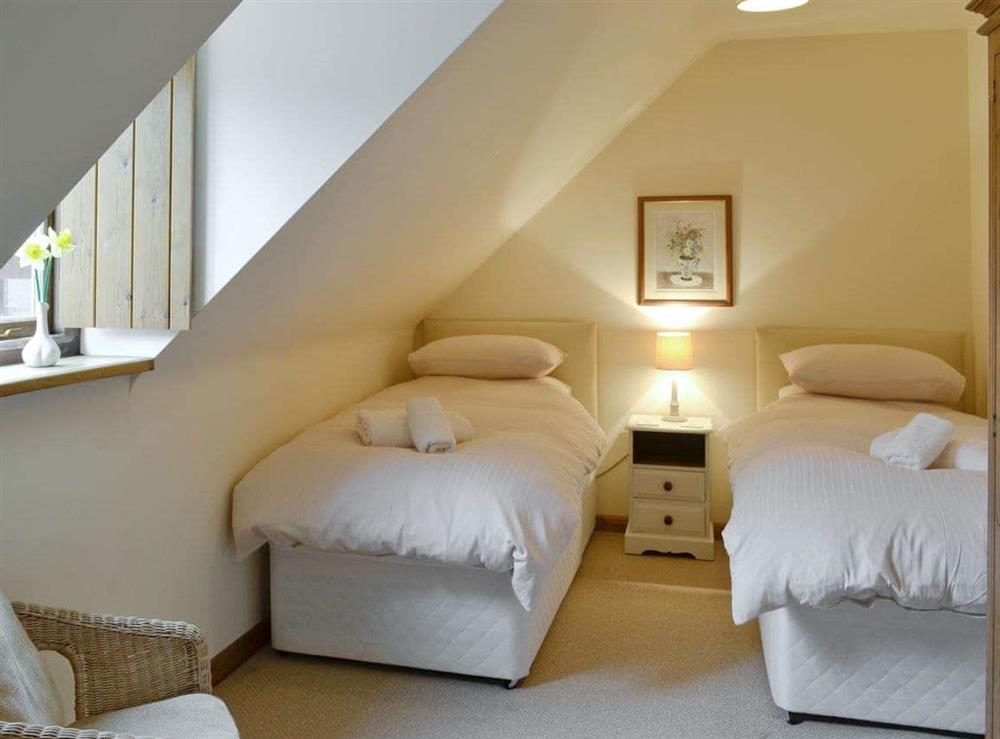 Comfortable twin bedroom at Honey Cottage, 