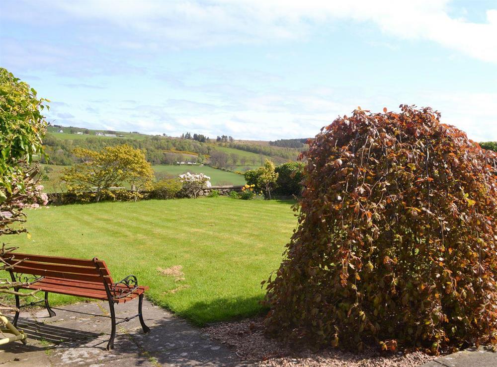 Lawned garden to front at Bramble Cottage in Ardendrain, near Beauly, Inverness-Shire