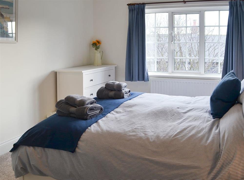 Comfortable double bedroom at Bramble Cottage in Craster, near Alnwick, Northumberland