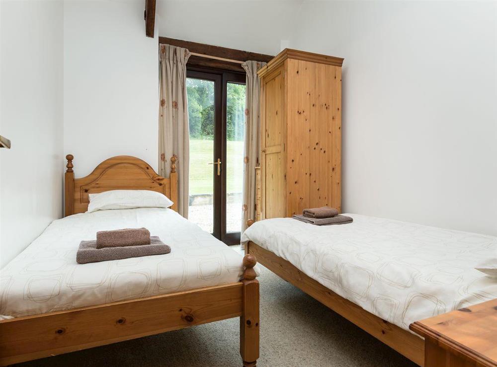 Cosy twin bedroom at Bramble Cottage in Foxcote, near Radstock, Avon