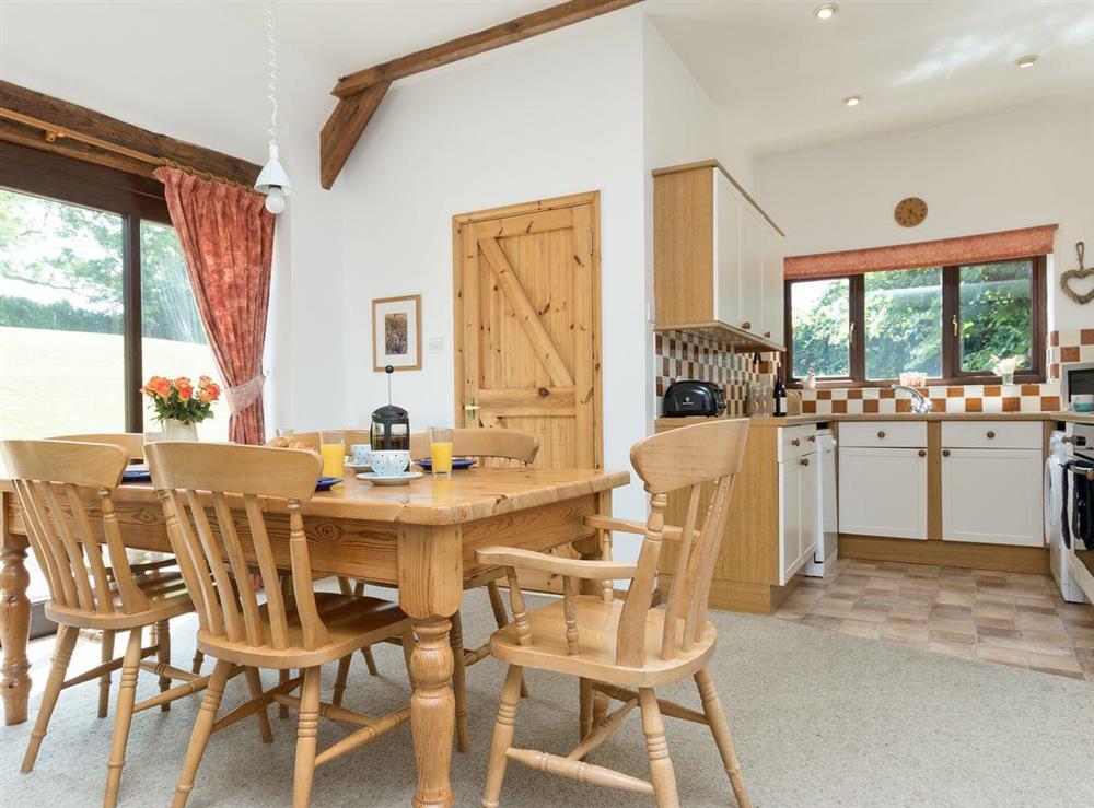 Dining area and kitchen at Bramble Cottage in Foxcote, near Radstock, Avon