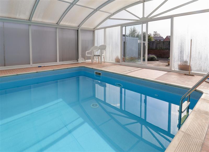 Enjoy the swimming pool at Bramble Lodge, Cuddington