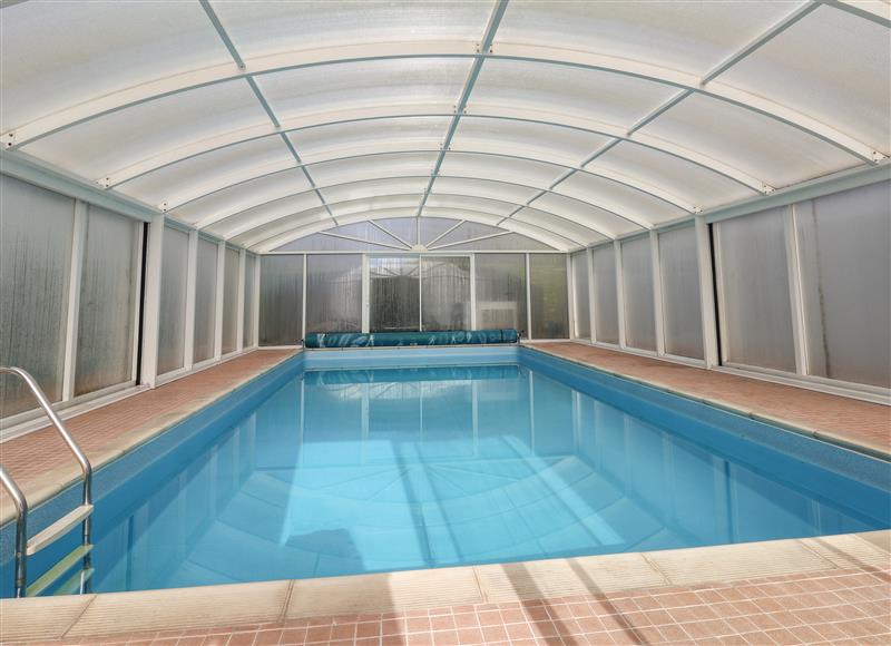 There is a swimming pool (photo 2) at Bramble Lodge, Cuddington