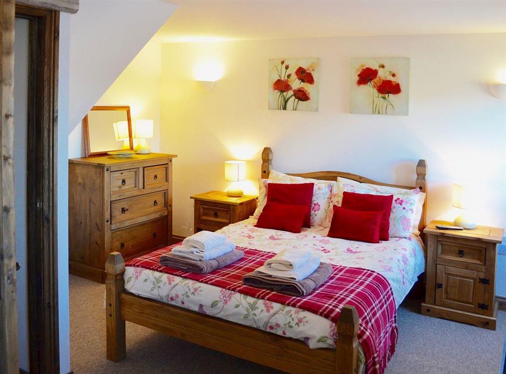 Relax in the romantic and cosy double bedroom at Bramble Lodge in Hartland, Devon