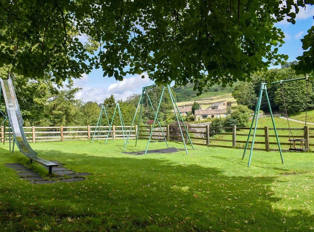Village playground located opposite the property (photo 2) at Brambledene in Hebden, near Grassington, North Yorkshire