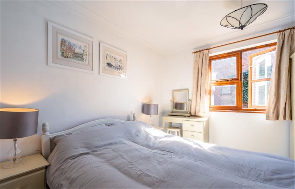 Ground floor: A sunny bedroom with dressing table at Brambles, Brancaster Staithe near Kings Lynn
