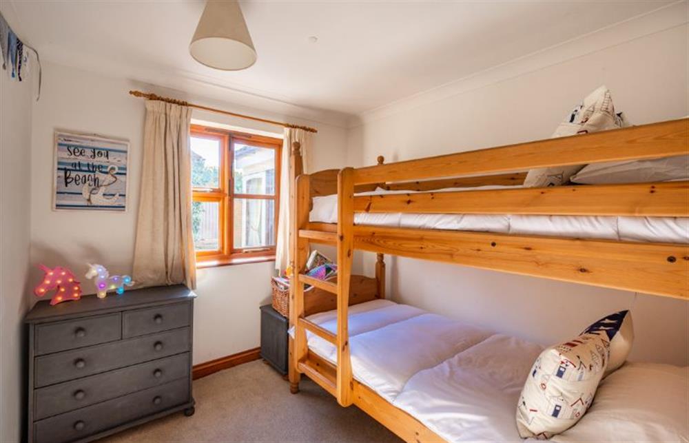 Ground floor: Bedroom three with solid oak frame 3ft bunk beds at Brambles, Brancaster Staithe near Kings Lynn