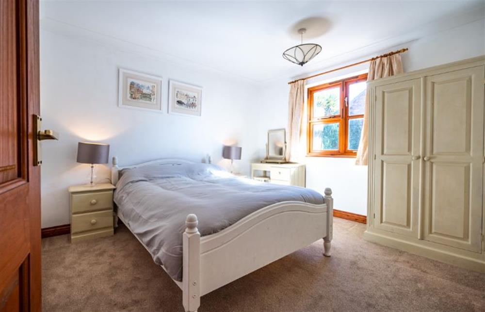 Ground floor: Bedroom two with double bed at Brambles, Brancaster Staithe near Kings Lynn