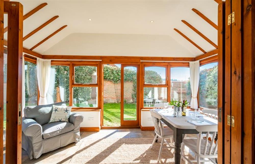 Ground floor: French doors open to the garden and bring the sun inside at Brambles, Brancaster Staithe near Kings Lynn