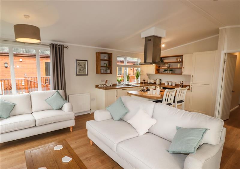 Relax in the living area at Bramblings by the Lake, Lakeside 7