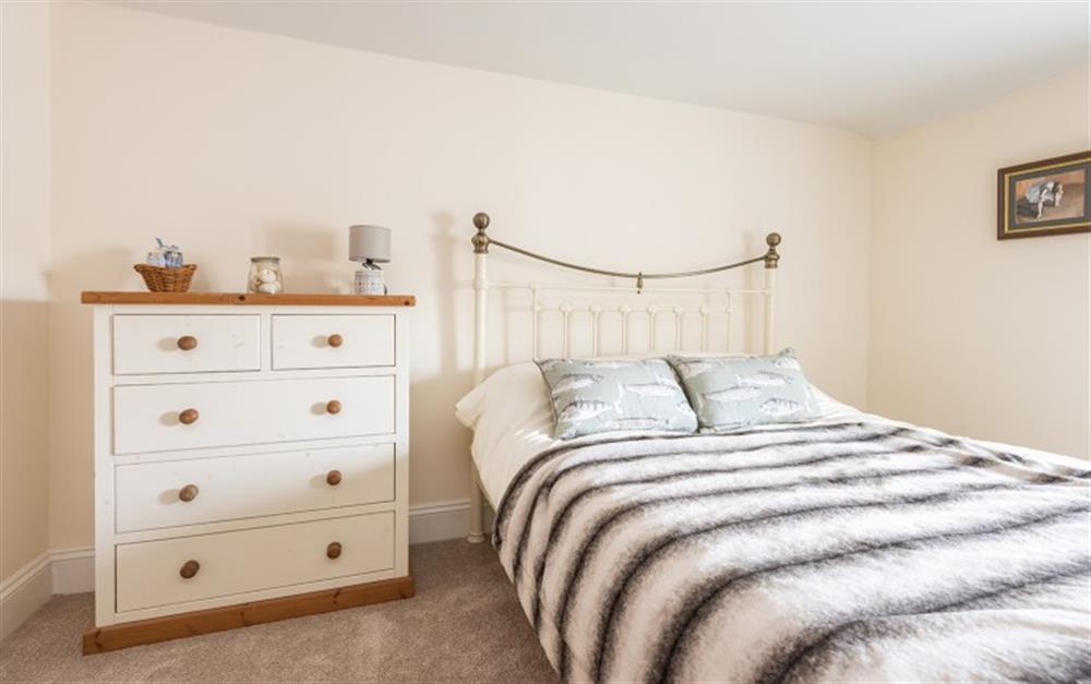 Bedroom 1 with views over the village at Bramley Cottage in Sherford