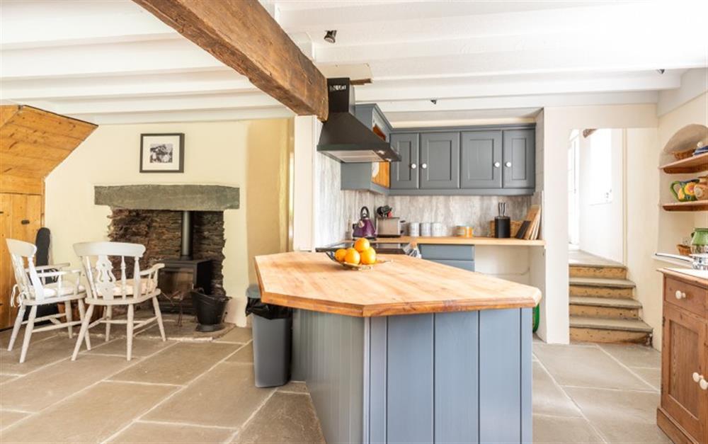 Breakfast bar and space to sit by the log burner at Bramley Cottage in Sherford
