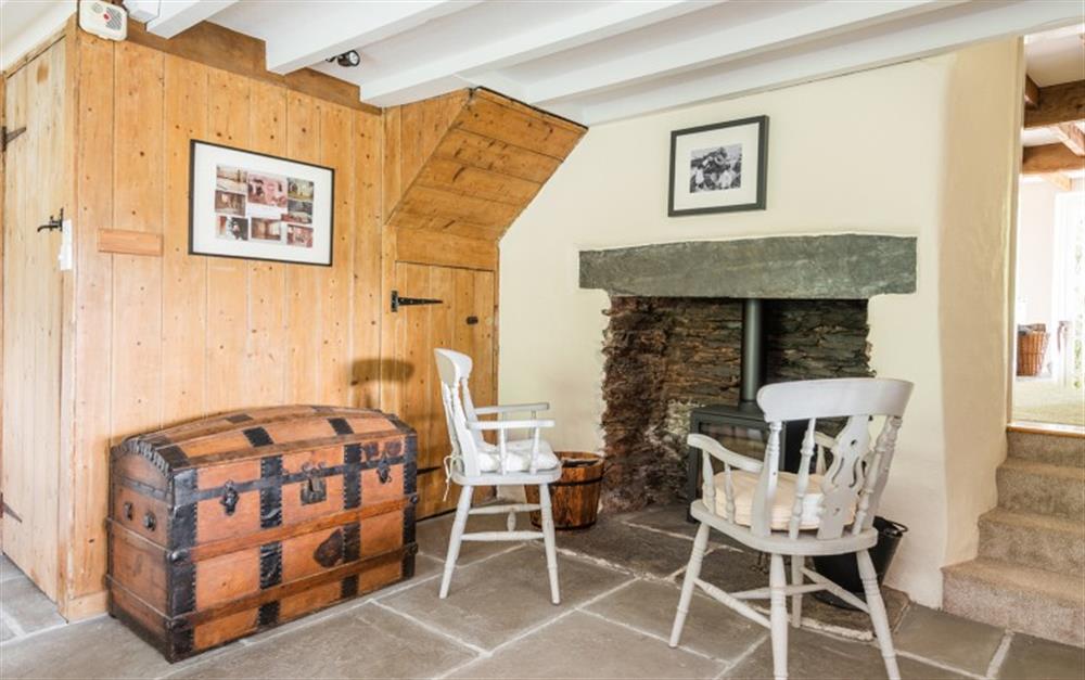 Cosy up by the log burner at Bramley Cottage in Sherford