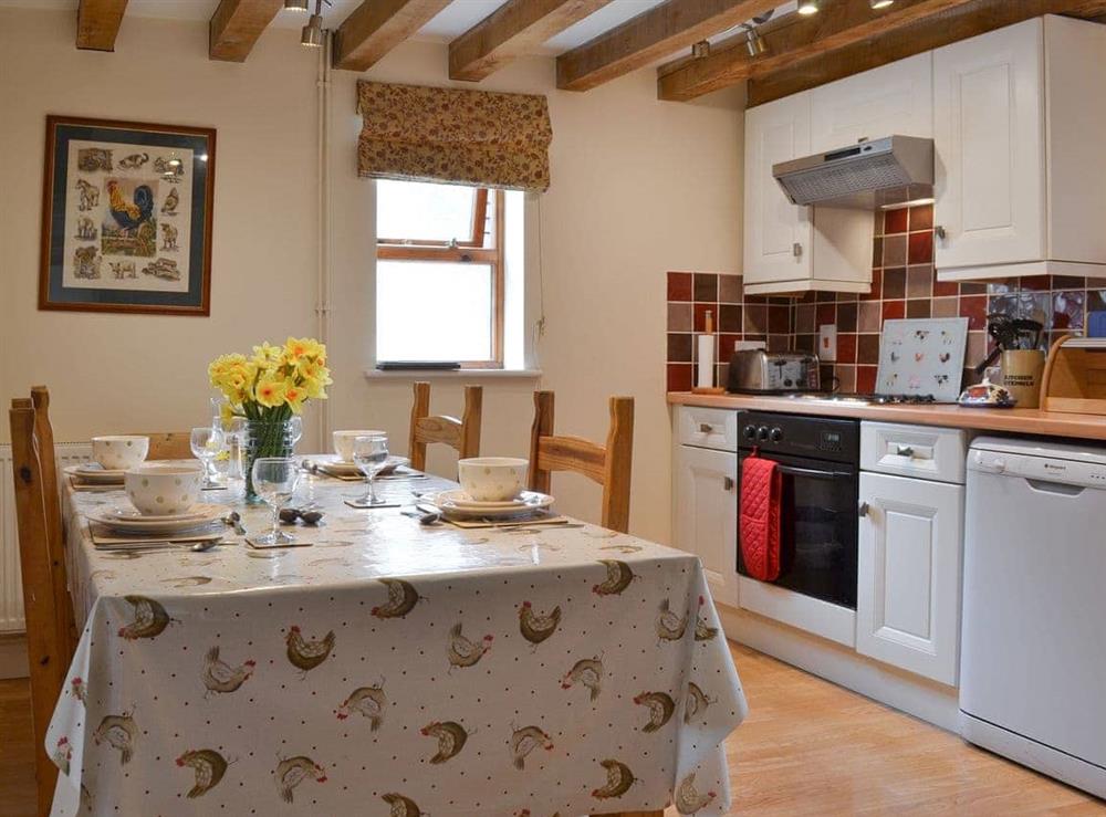 Kitchen with dining area at Brampton Hill Farm Cottage in Wormbridge, Herefordshire