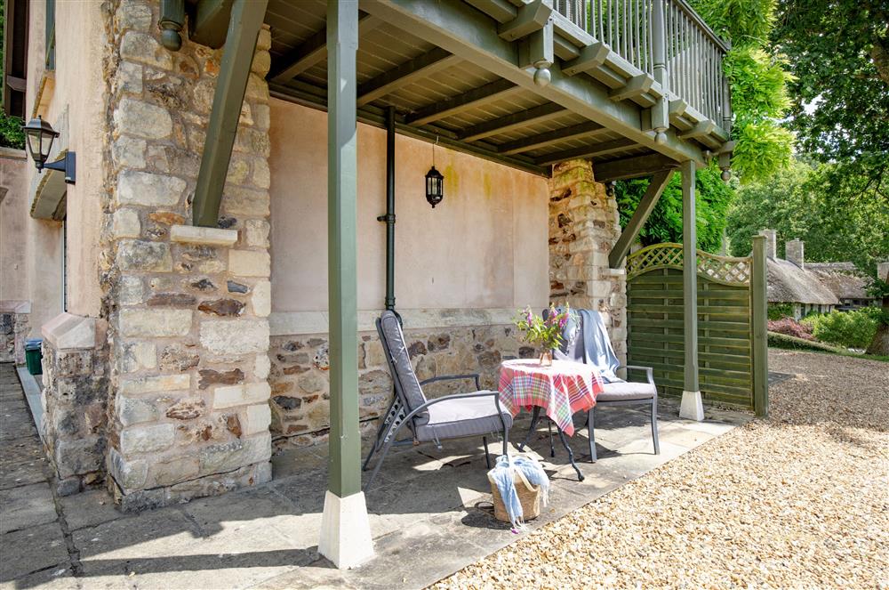 The patio set situated on the ground floor, under the first floor balcony