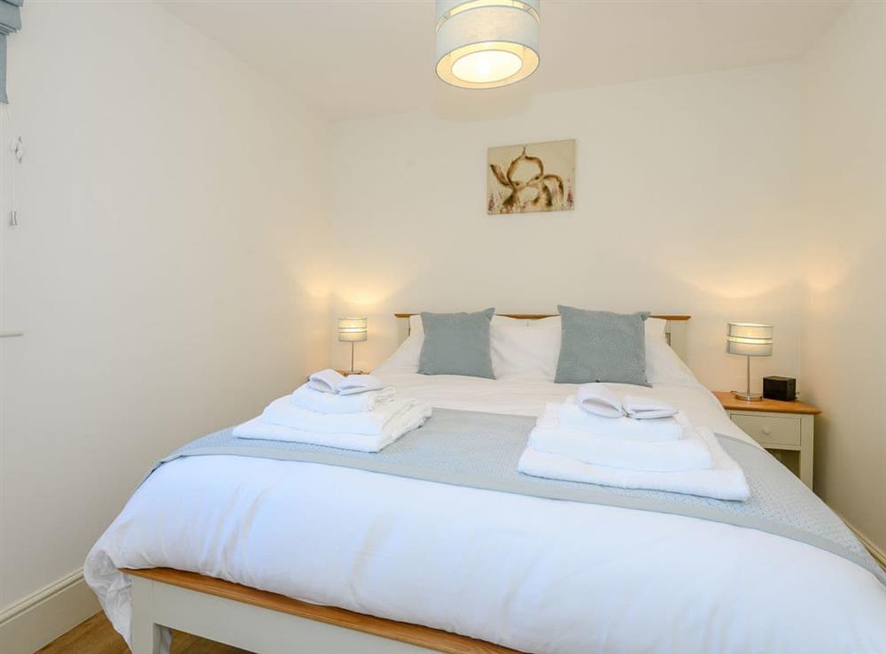 Peaceful second bedroom with king sized bed at Woodcutters Cottage, 