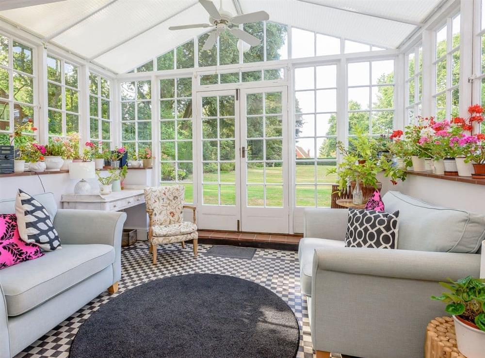 Light and airy conservatory with garden access at Braydeston House in Brundall, near Norwich, Norfolk