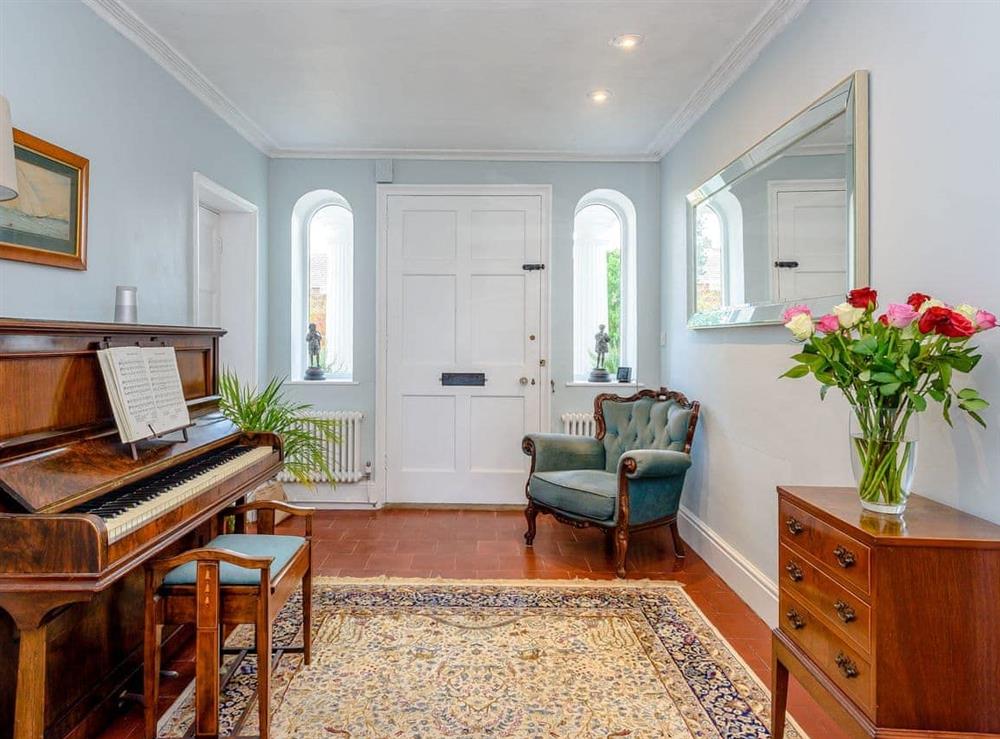 Piano in the hallway at Braydeston House in Brundall, near Norwich, Norfolk