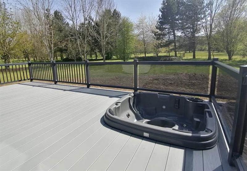 Decked area and hot tub in Fallow Lodge at Bredon View in Pershore, Worcestershire
