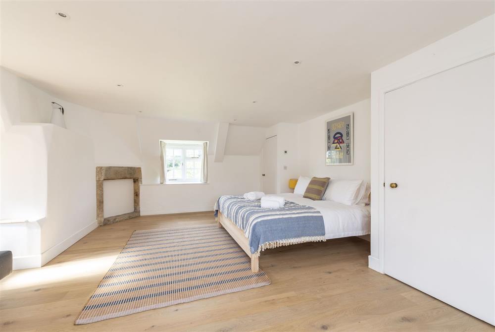Bedroom two with 6’ super-king size be, sofa and triple aspect views (photo 3) at Brew House Cottage, Clifton Maybank, nr Sherborne