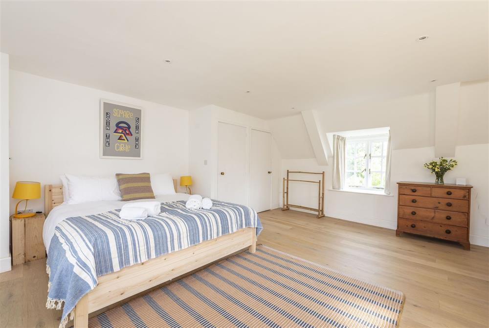 Bedroom two with 6’ super-king size be, sofa and triple aspect views at Brew House Cottage, Clifton Maybank, nr Sherborne