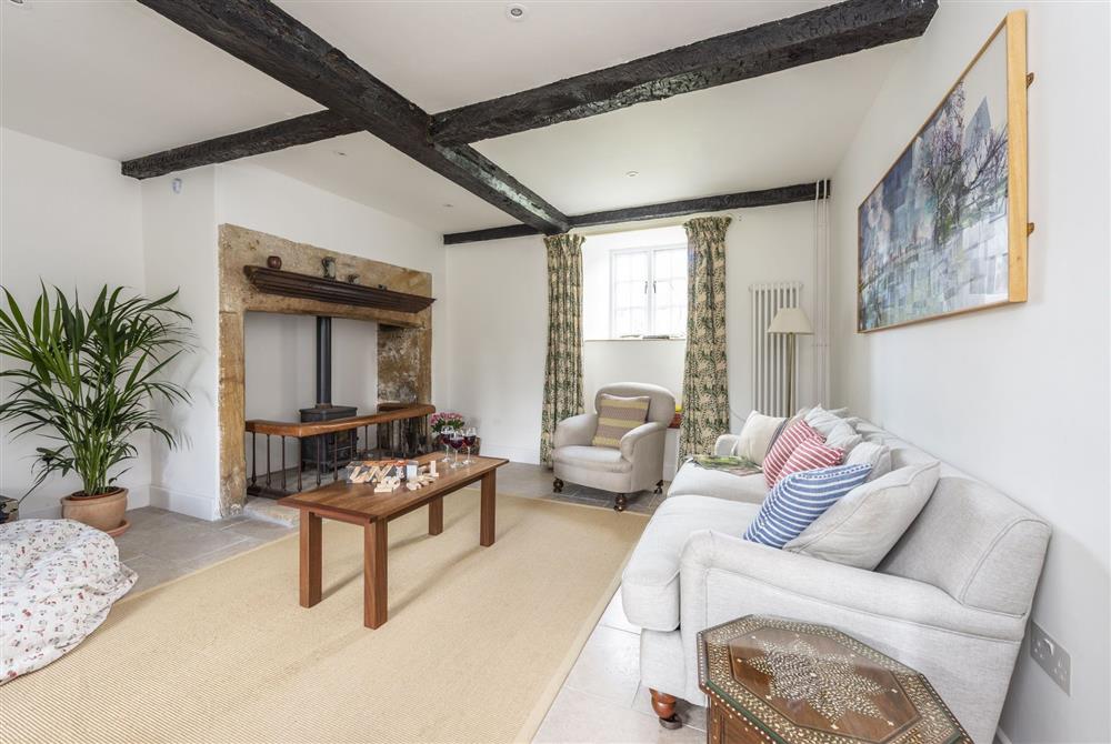 Sitting room with wood burning stove at Brew House Cottage, Clifton Maybank, nr Sherborne