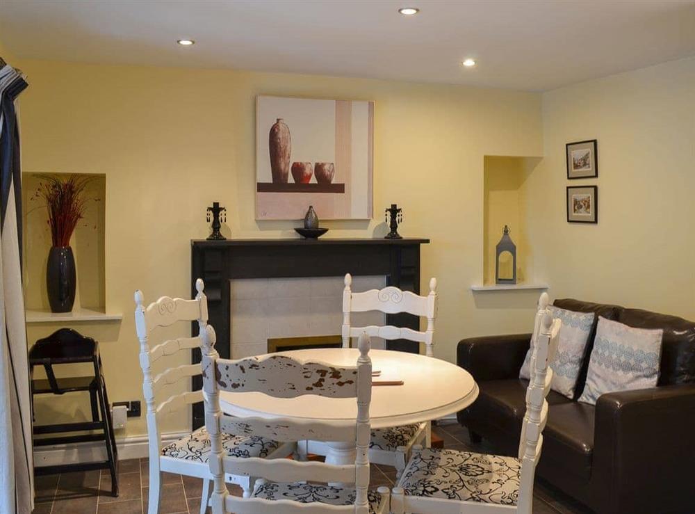 Light and bright dining area with doors to the garden at Brewers Cottage in Cropton, near Pickering, North Yorkshire