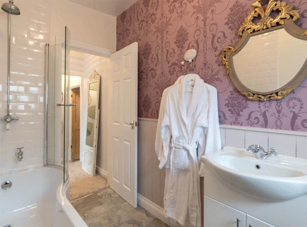 Elegant family bathroom with shower over bath at Brewery House Cottage in Bishop Middleham, near Durham, England