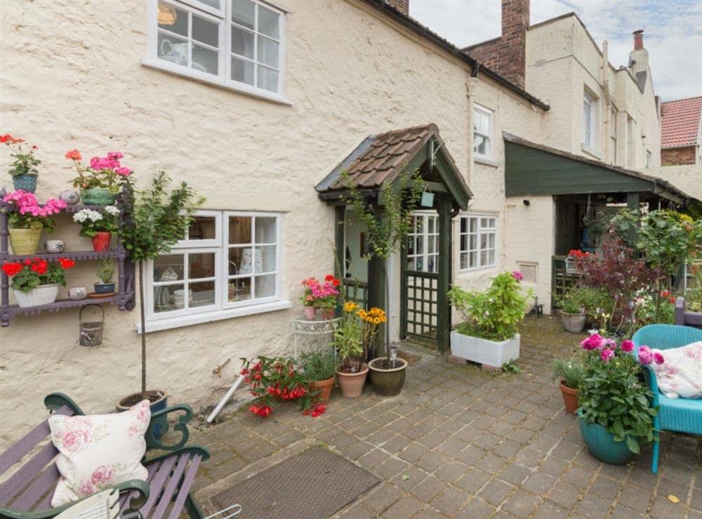 Spacious rear courtyard at Brewery House Cottage in Bishop Middleham, near Durham, England