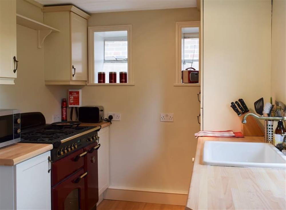 Well-equipped kitchen at Briar Cottage in Prinsted, near Emsworth, West Sussex