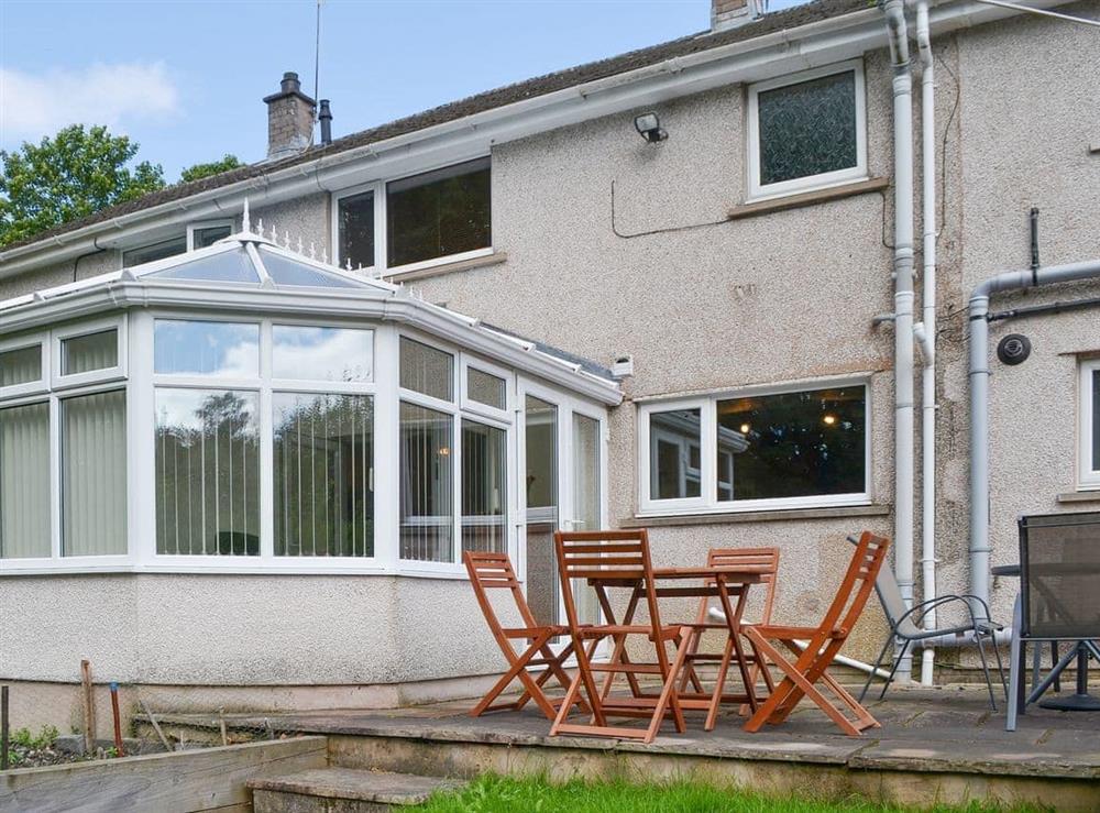 Raised patio area adjacent to the conservatory at Briar Rigg in Keswick, Cumbria