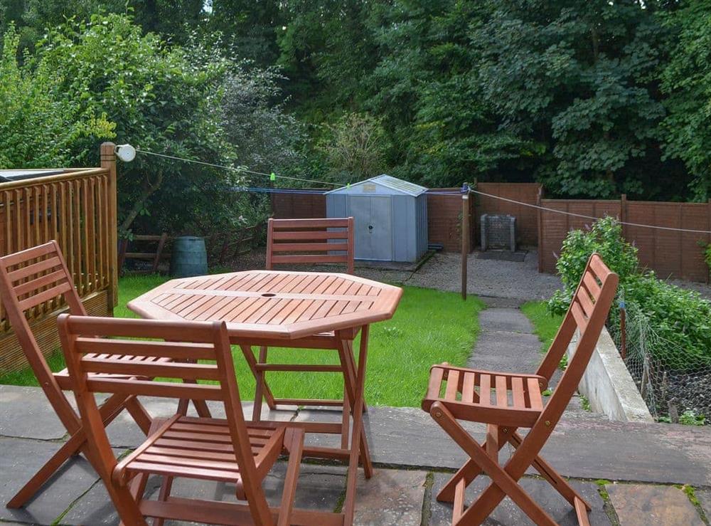 The sitting out area has a great vantage point over the large lawned garden at Briar Rigg in Keswick, Cumbria