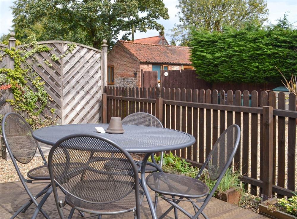 Enclosed patio area with outdoor furniture at Briarwood in Norwich, Norfolk