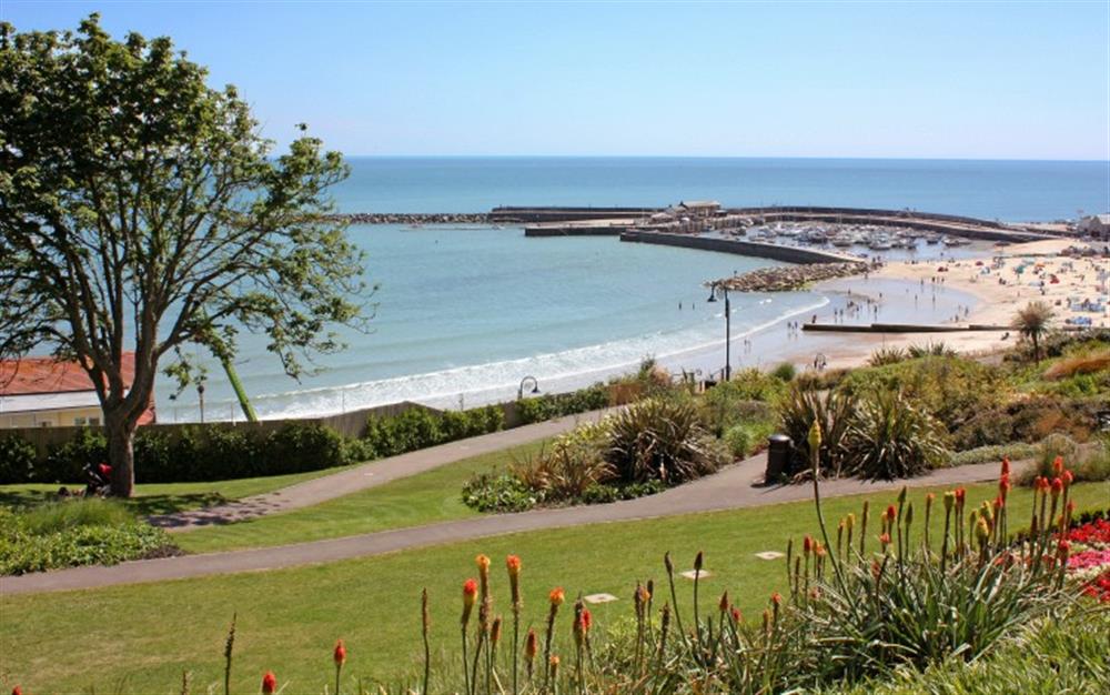 Nearby Lyme Regis - views across Langmoor gardens to the beach and Cobb Harbour at Bridge Cottage in Powerstock