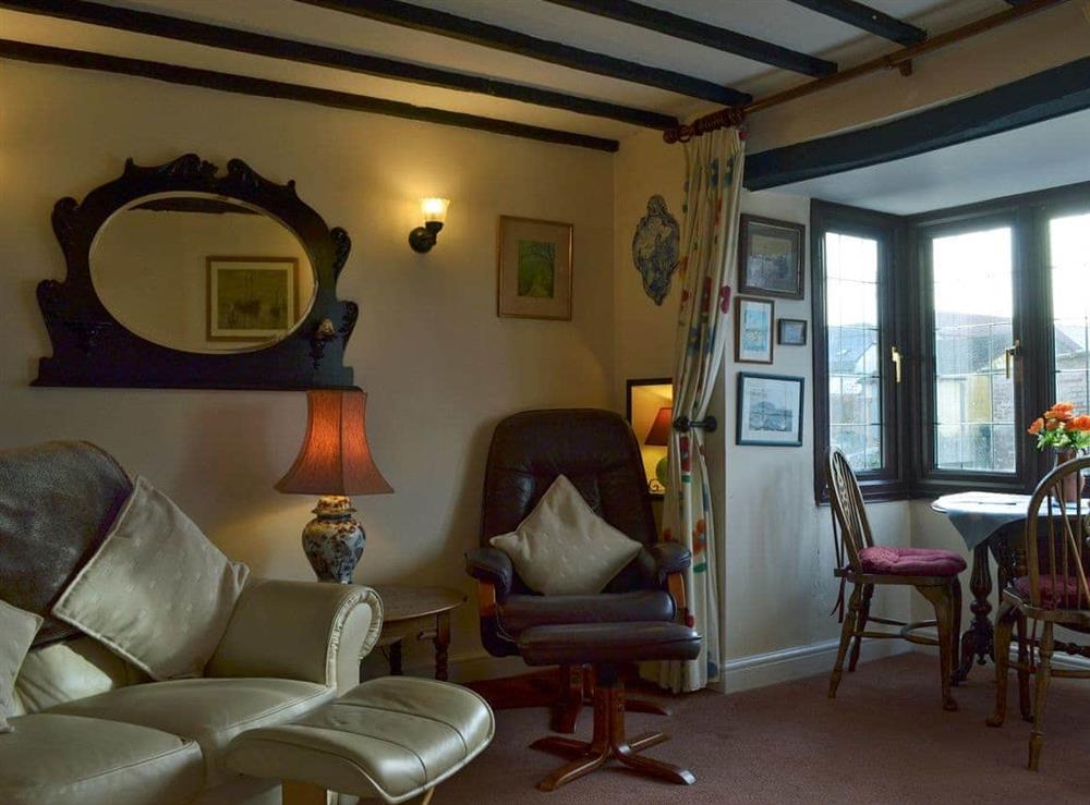 Cosy beamed living/dining room (photo 2) at Bridge Cottage in Watchet., Somerset