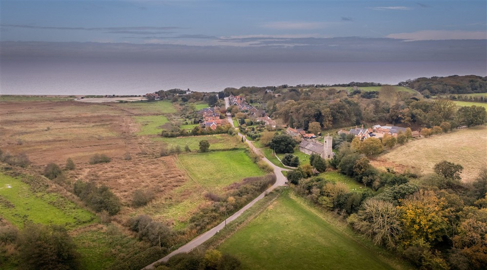 An aerial view of Dunwich village and the coast near Bridge Farm Cottage in autumn, Suffolk