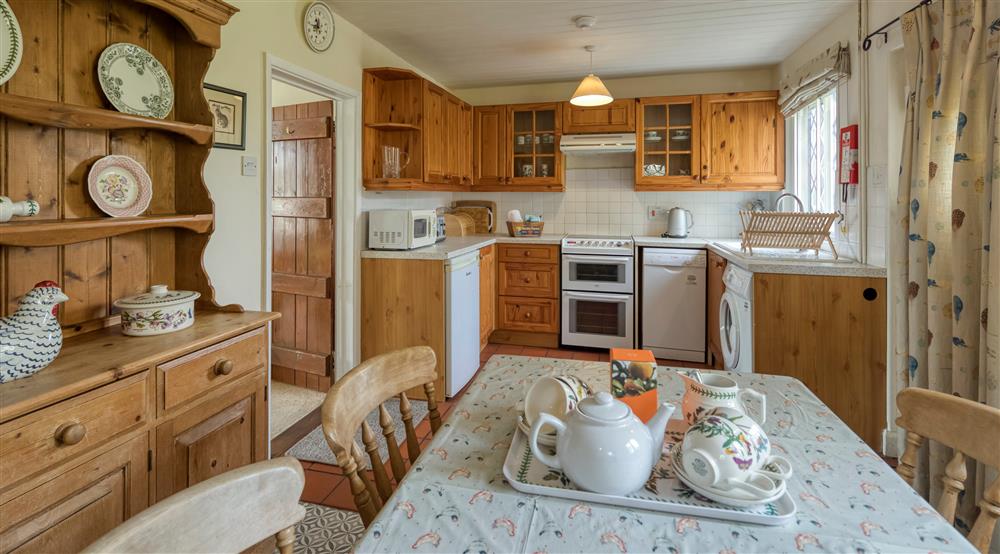 The kitchen and dining room at Bridge Farm Cottage in Saxmundham, Suffolk