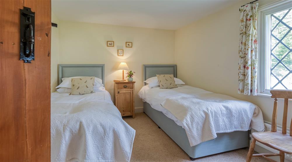 The twin bedroom at Bridge Farm Cottage in Saxmundham, Suffolk