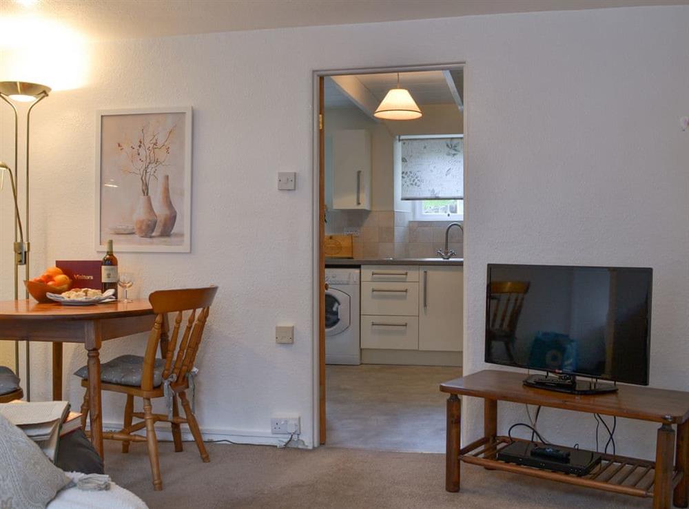 Living room with dining area at Bridgend Cottage in Lostwithiel, Cornwall